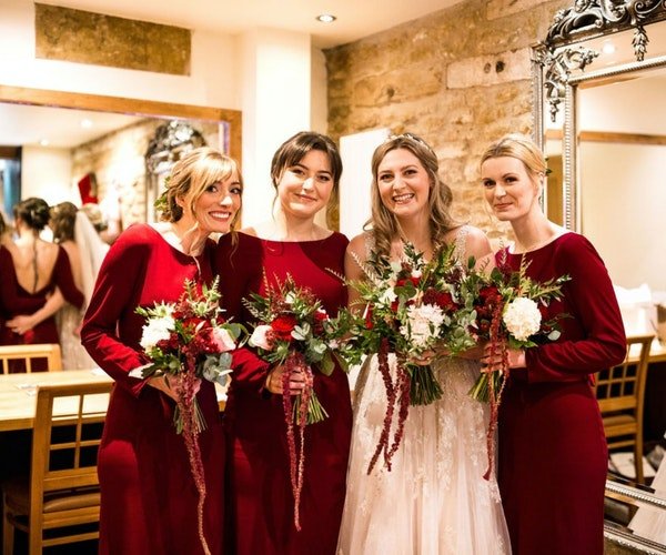 Bridesmaids' posies tied with natural ribbon