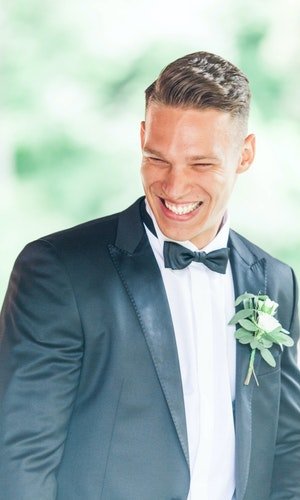 Seasonal groomsmen buttonholes lined up