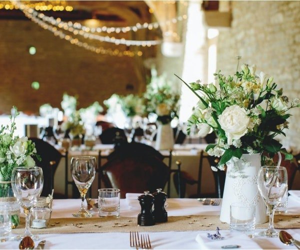 A wedding centrepiece by Field Gate Flowers A wedding centrepiece by Field Gate Flowers