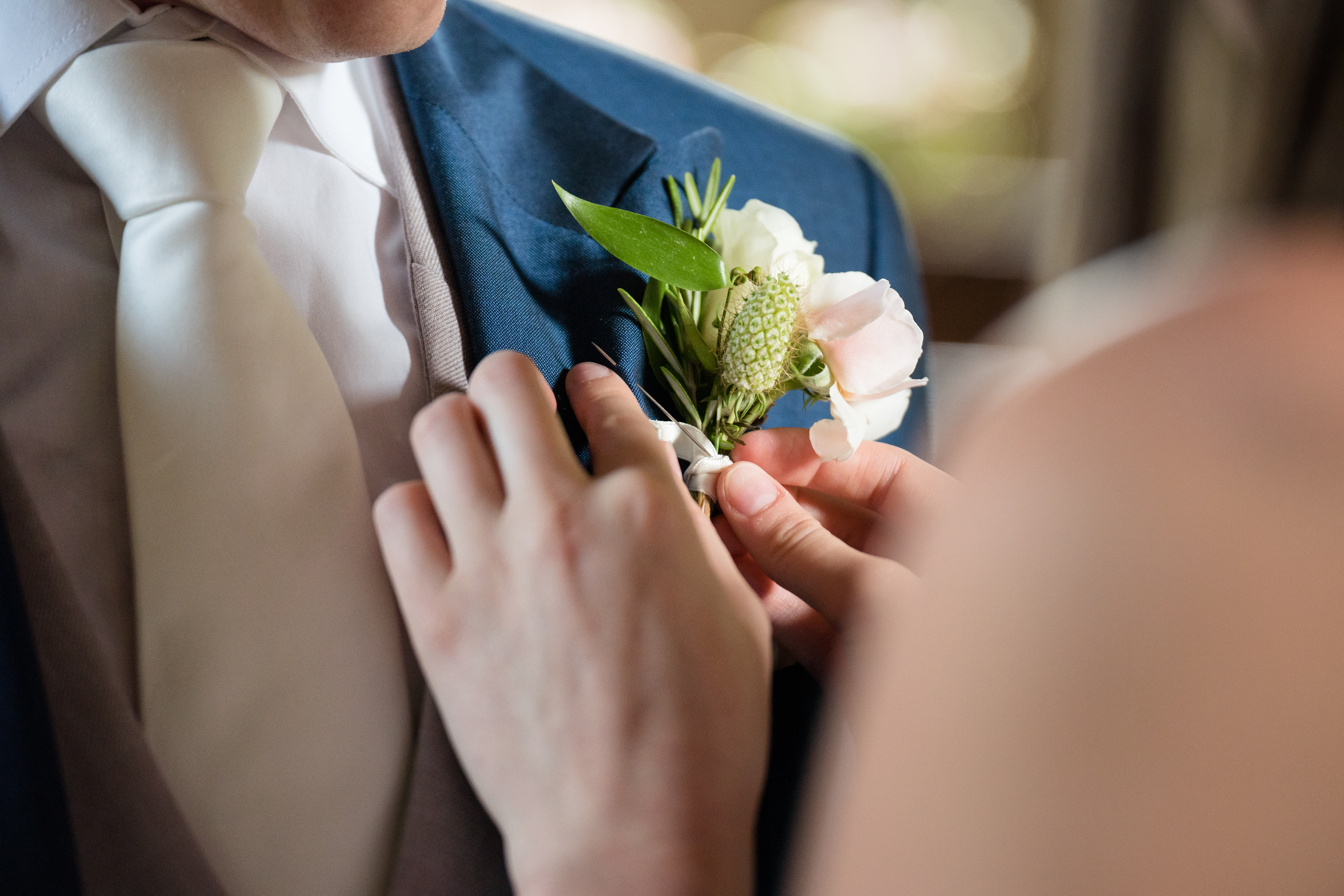 A seasonal buttonhole of cornflowers and foliage